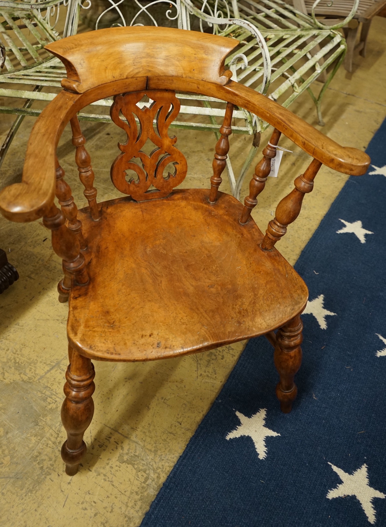 A Victorian elm and beech pierced back bow smoker's chair, width 66cm, depth 45cm, height 80cm